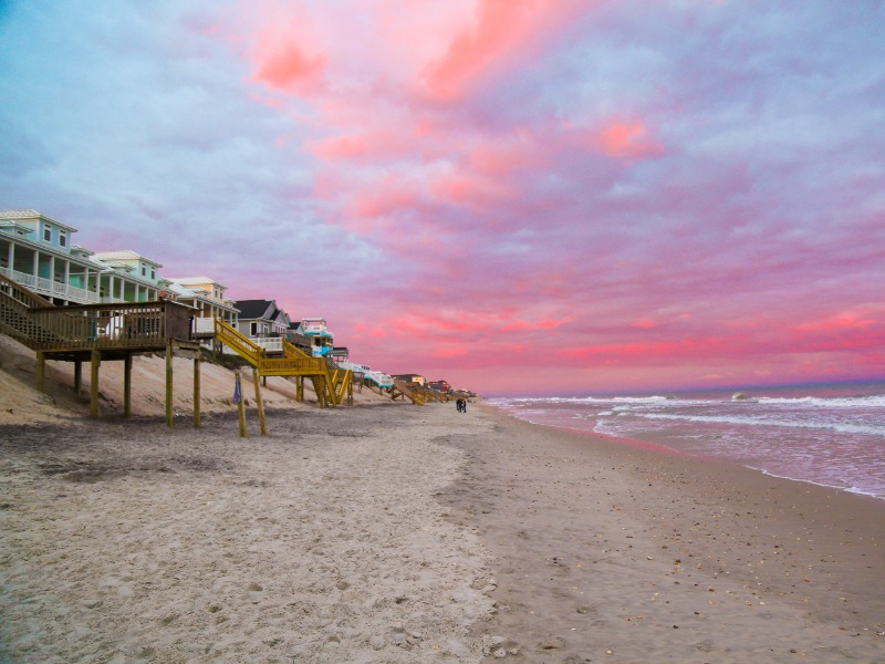 Photo of sunset by crystal coast homes on the beach