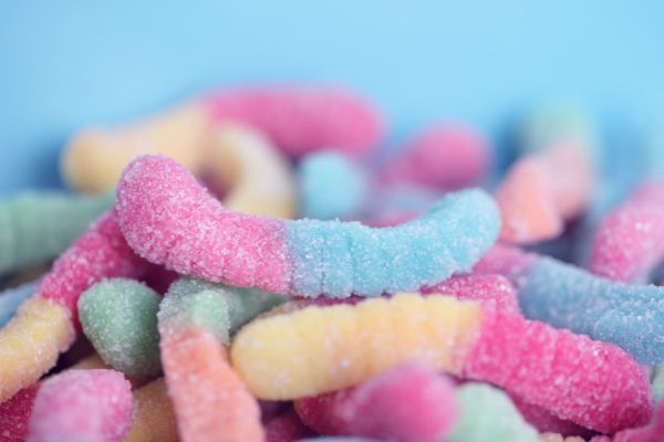 Close up of sour gummy worms at the candy store