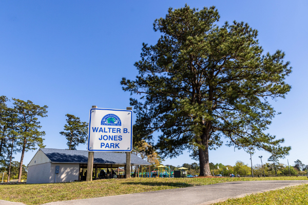 The Walter B. Jones Park sign and trees