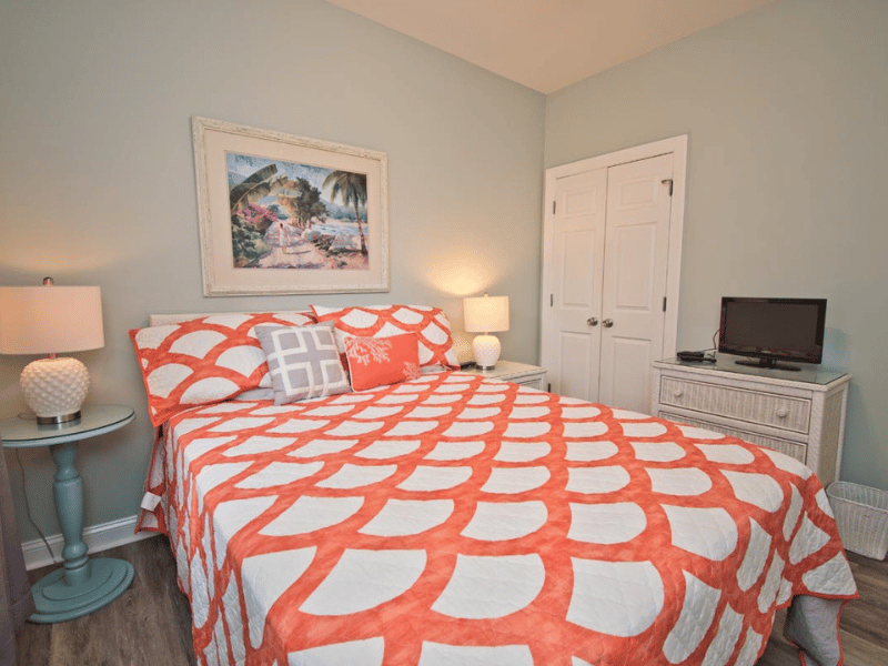 Bright and colorful queen bedroom in Indian Beach condo 