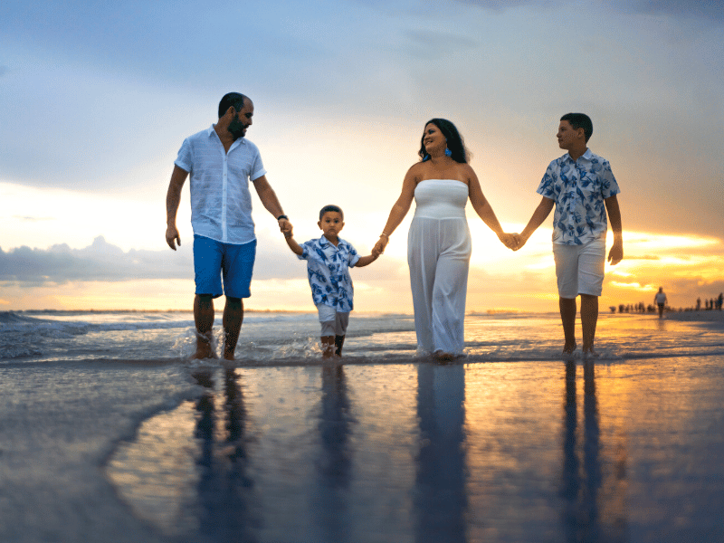 a family walks on the beach in Emerald Isle NC