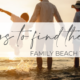 A family walks along a vacant shoreline near their beach vacation rental on the Crystal Coast.